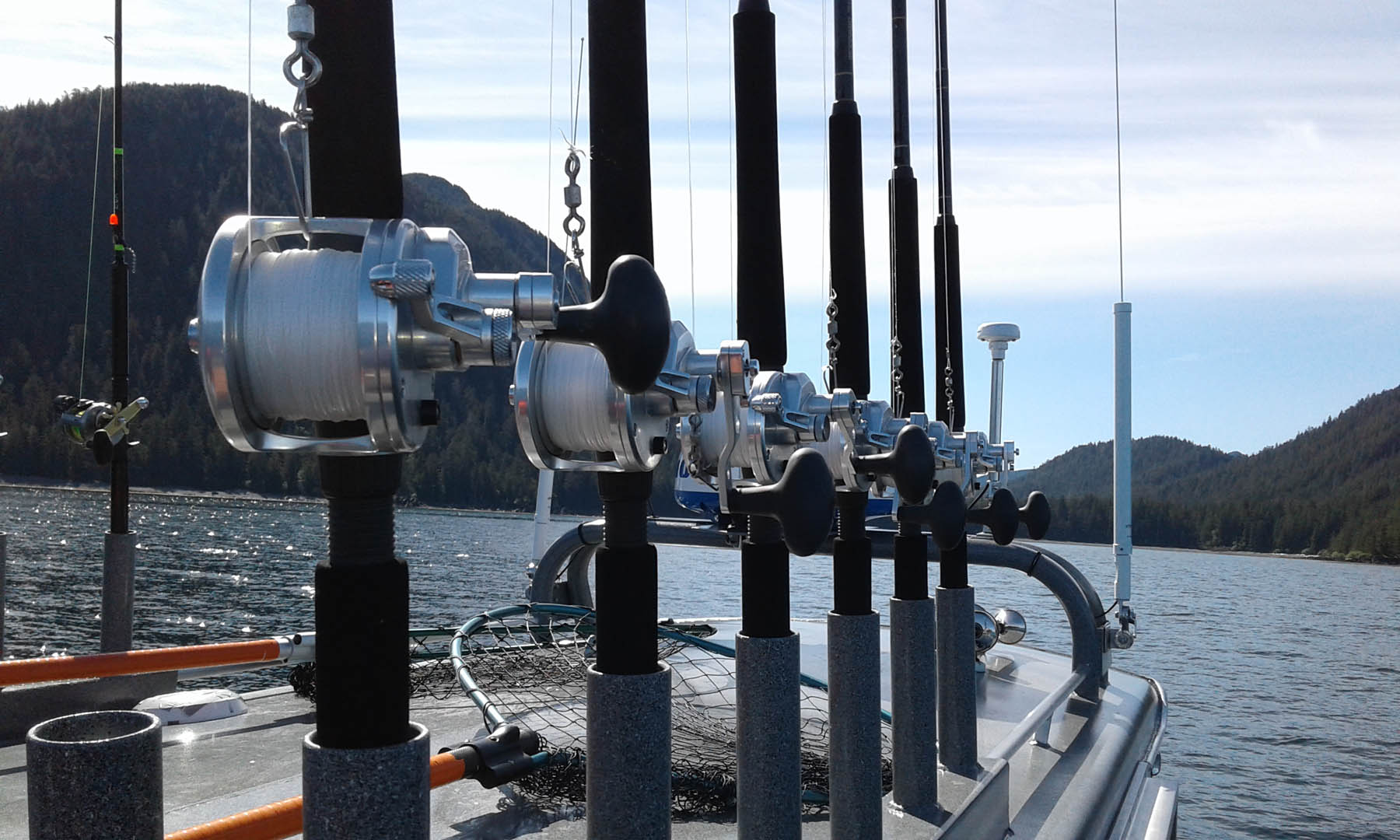 close up of fishing rods on the boat.