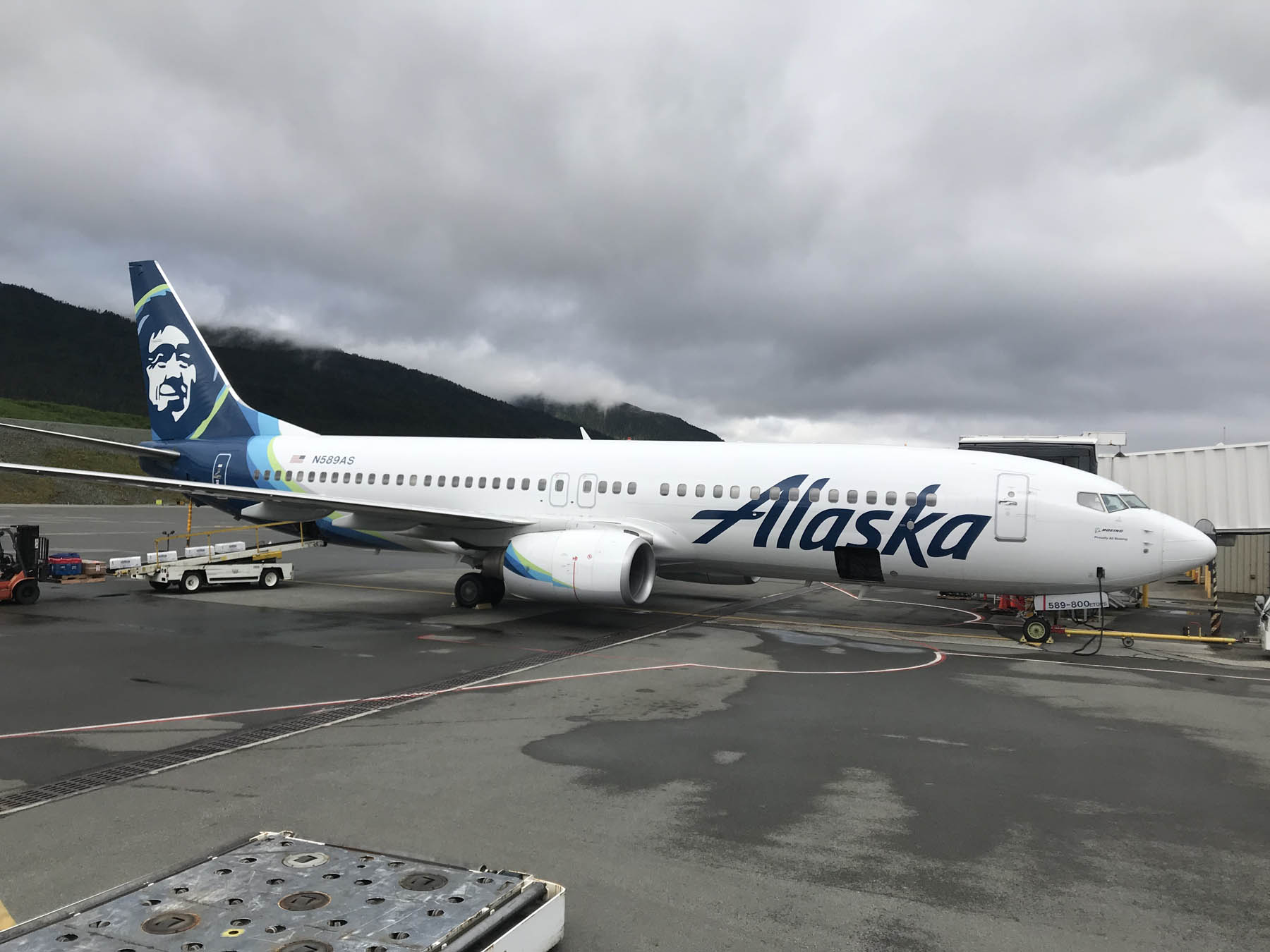 Alaska Air passenger plane at an airport gate.