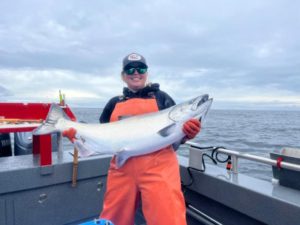 person-in-orange-with-large-salmon-2
