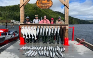 Anglers showcasing the day's catch during an Alaska fishing trip